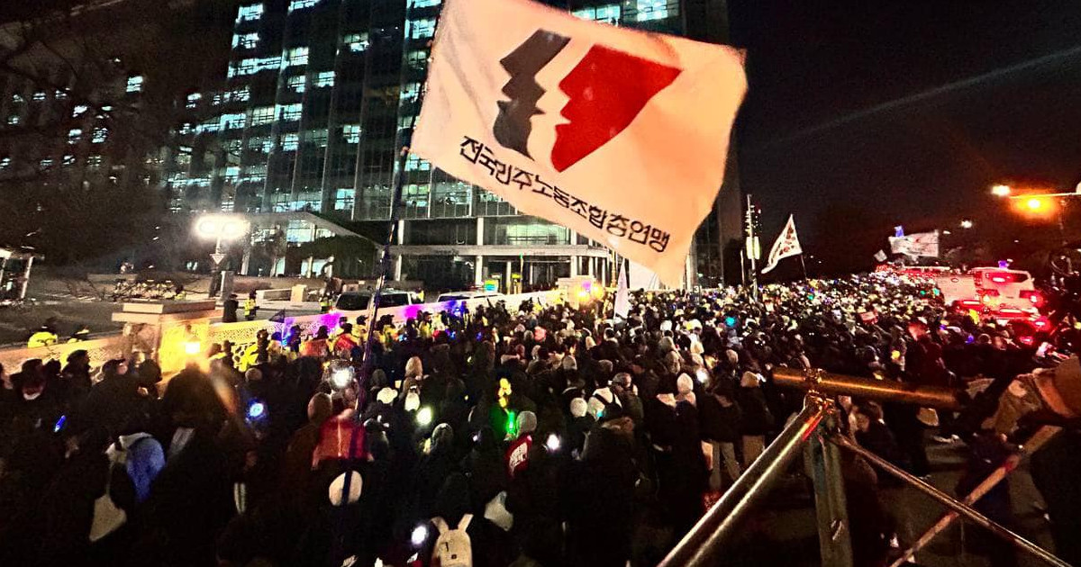 Nighttime rally with KCTU flag