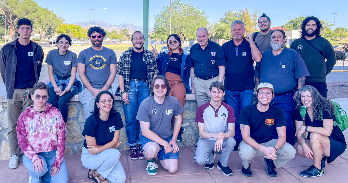 A group of sixteen UE members from New Mexico locals posing together