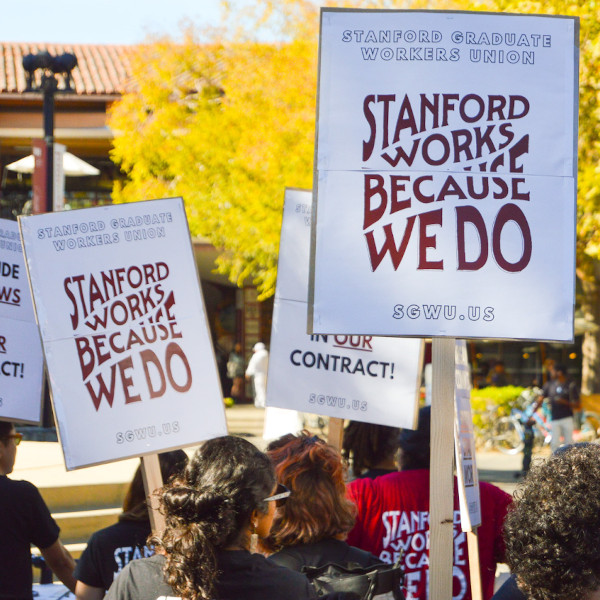 Union signs reading Stanford Works Because We Do