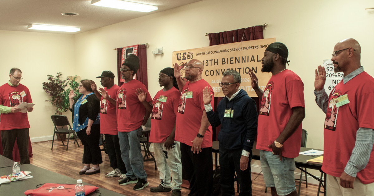 UE General Secretary Andrew Dinkelaker swearing in new UE Local 150 officers and trustees.