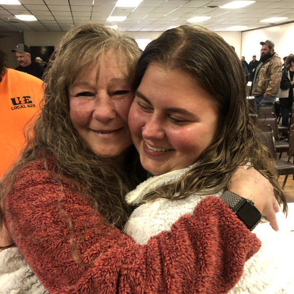 A mother and daughter embracing