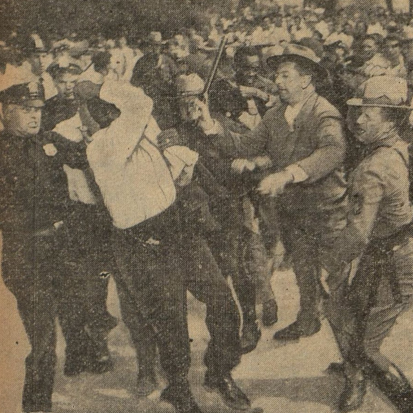 Old newspaper photograph of police beating a Black man